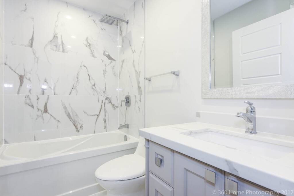 Photo of an renovation project showing a finished interior space without construction materials in view bathroom renovation