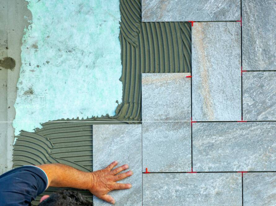 Top view of a tiler working in a garden.